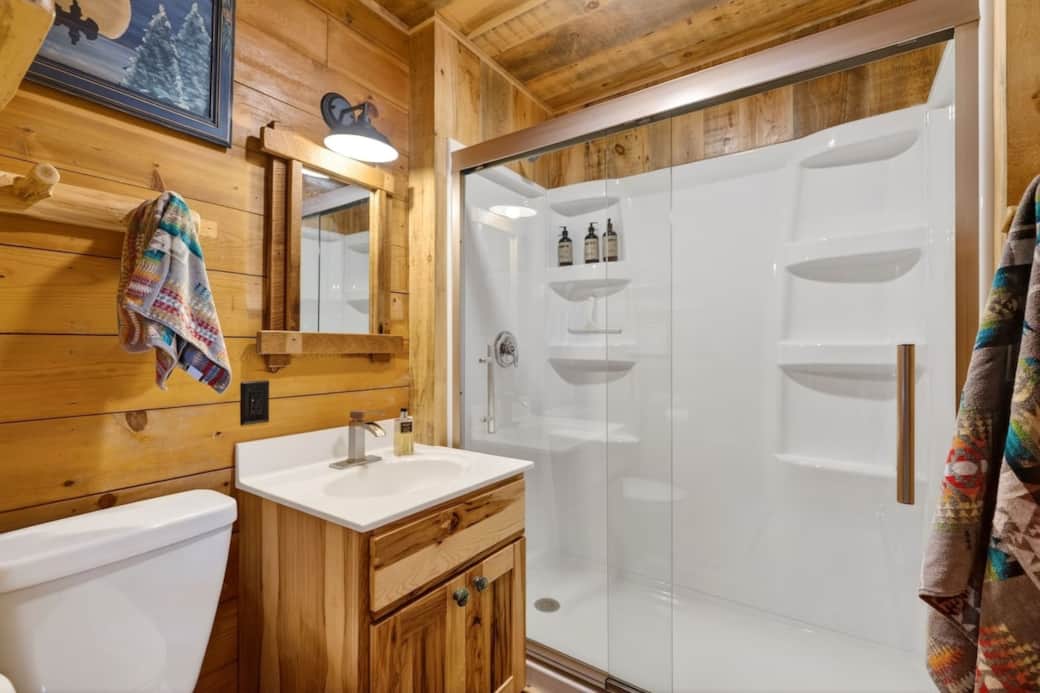 The brightly lit bathroom also has a magnifying mirror (not shown). 