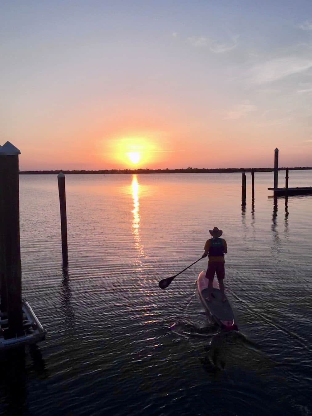 Paddleboarding off our dock at sunrise
