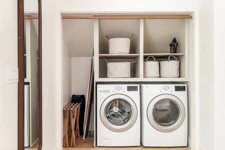 Washer/dryer, luggage racks (2), iron and ironing board, pack and play, hangers. 