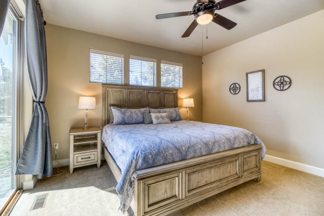 Main-floor king suite with Simmons Beautyrest mattress and room-darkening shades