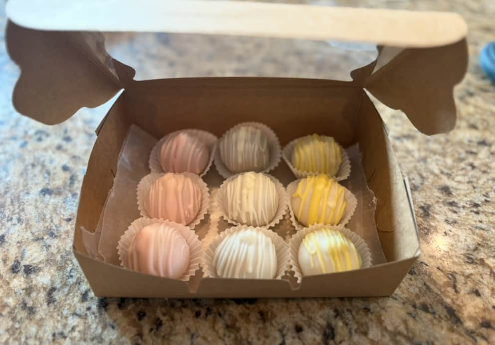 Custom cake and baked treats from White Magnolia Bread Co. set out for guests