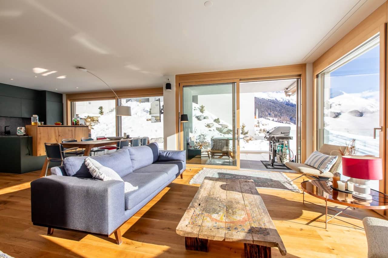 Light, space, and breathtaking views — the open living area features floor-to-ceiling windows that bring the Swiss Alps right into your home.