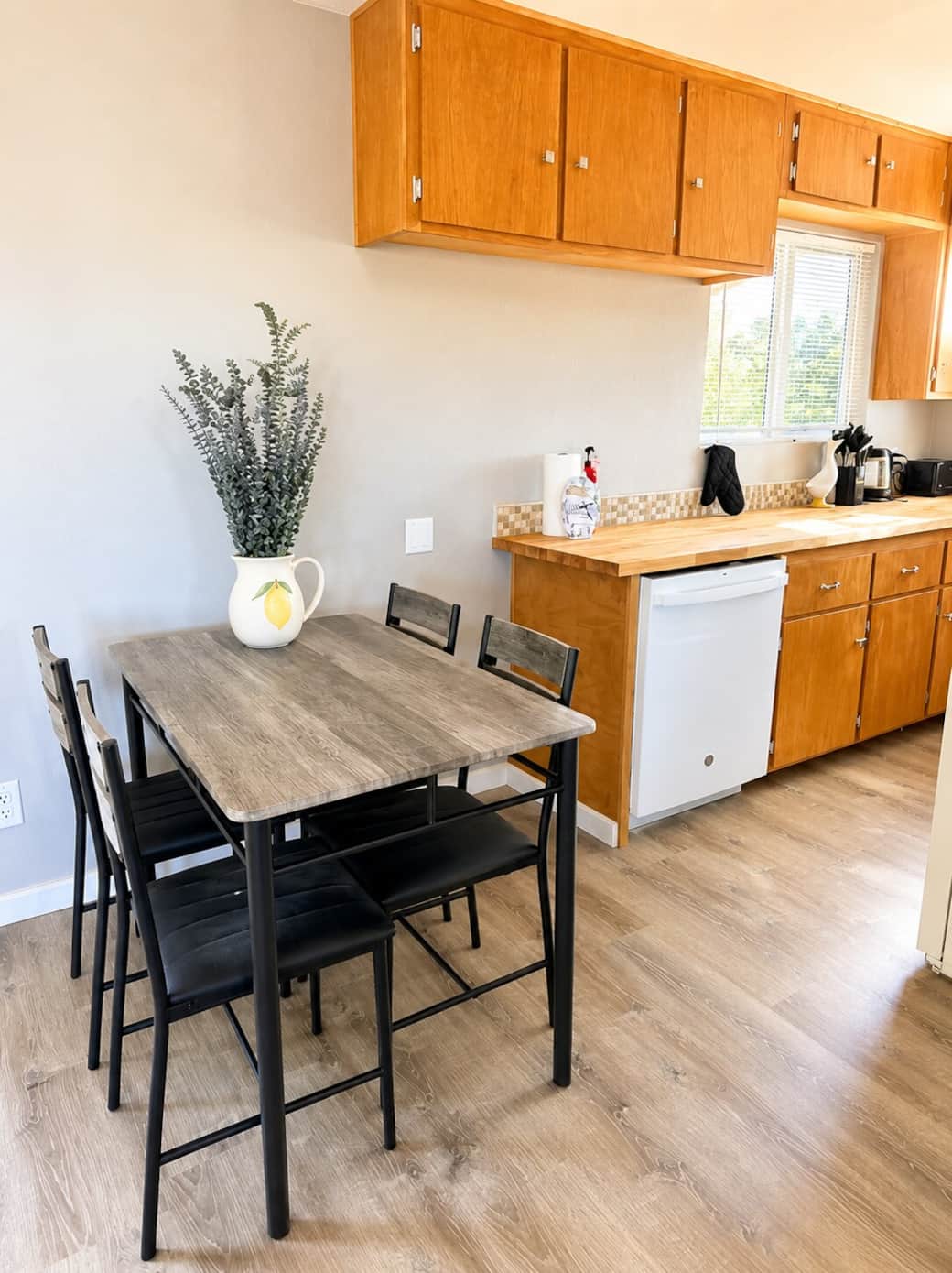 Bright farmhouse-style dining area with natural light, butcher block counters, cozy seating, and clean modern finishes. A comfortable space to enjoy breakfast, coffee, or a relaxing meal after exploring Amador wine country and nearby wineries. Bright farmhouse-style dining area with natural light, butcher block counters, cozy seating, and clean modern finishes. A comfortable space to enjoy breakfast, coffee, or a relaxing meal after exploring Amador wine country and nearby wineries.