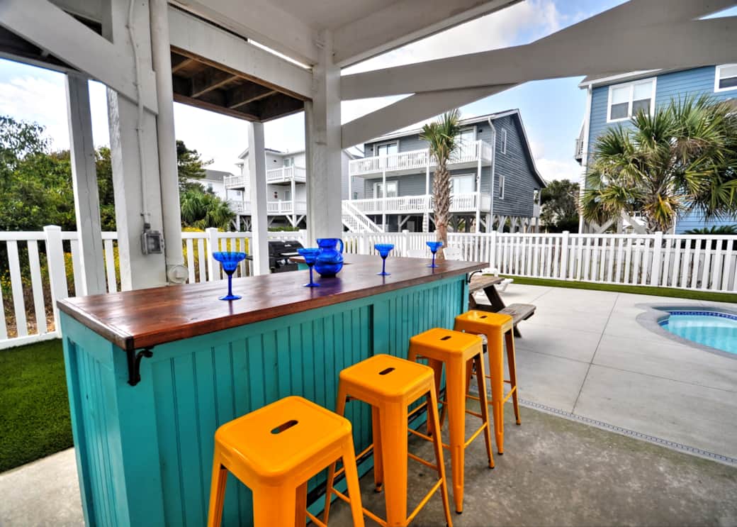 Enjoy drinks at the tiki bar while being steps away from the second refrigerator.