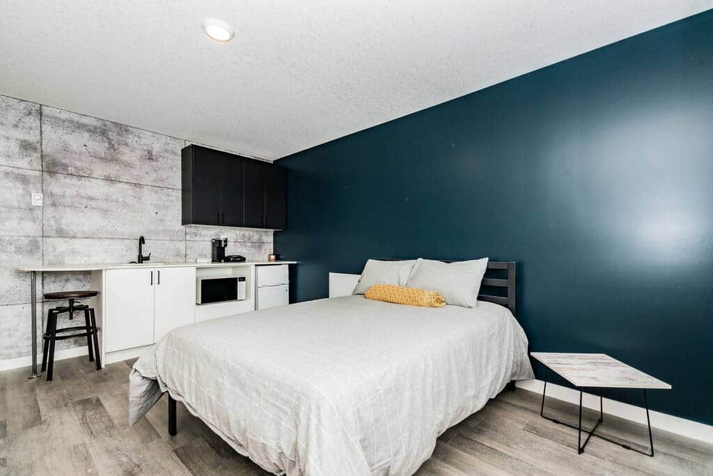 Modern trendy bedroom with kitchenette Modern trendy bedroom with kitchenette
