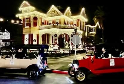 Christmas light tour passing decorated historic homes in Galveston’s East End with Carriage Haus Tours