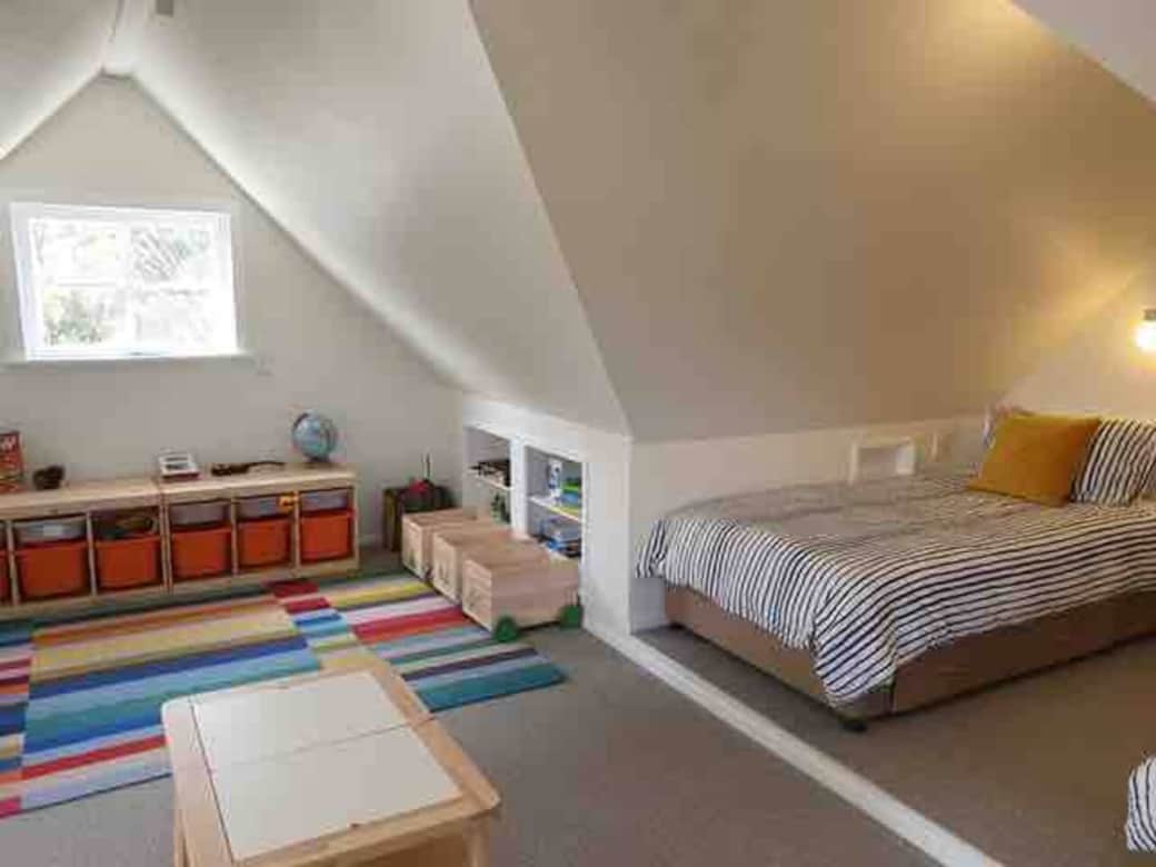 The attic is furnished with kids in mind - kid sized furniture, toys, games, books, and an easel 