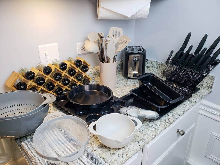 Basic cookware, sharp knives and a spice rack are provided