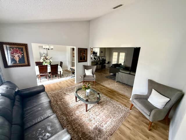 Relax with family and friends on comfortable chairs and leather sleeper sofa