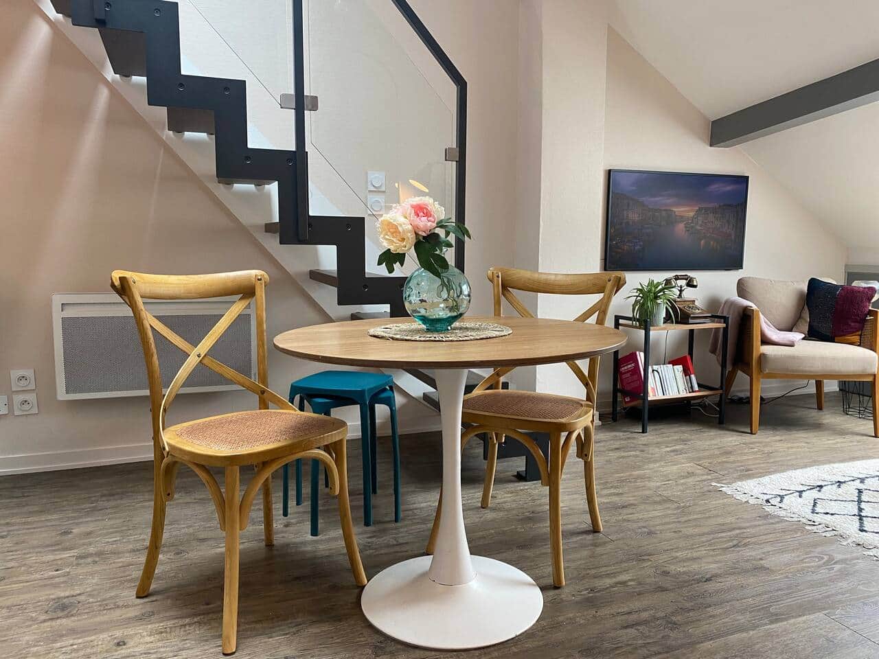Enjoy meals in a charming dining area of this elegant Annecy flat