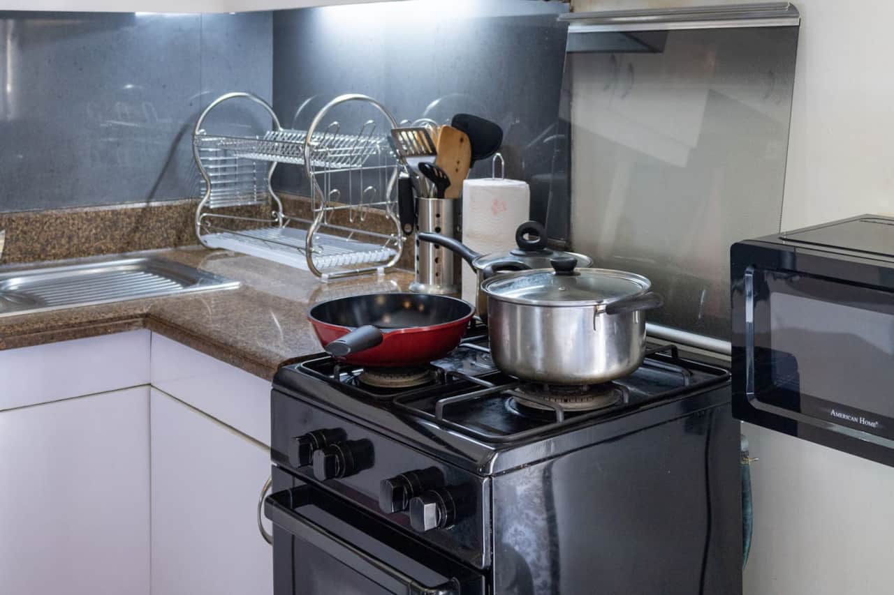 Full Kitchen:
- Gas Range
- Rice Cooker
- Toaster
- Water kettle
- Microwave
- Refrigerator
- Pots and Pans
- Cooking Utensils
- Knives and Chopping Board
- Dishwashing Liquid and Sponge
- Rags
- Cleaning Supplies