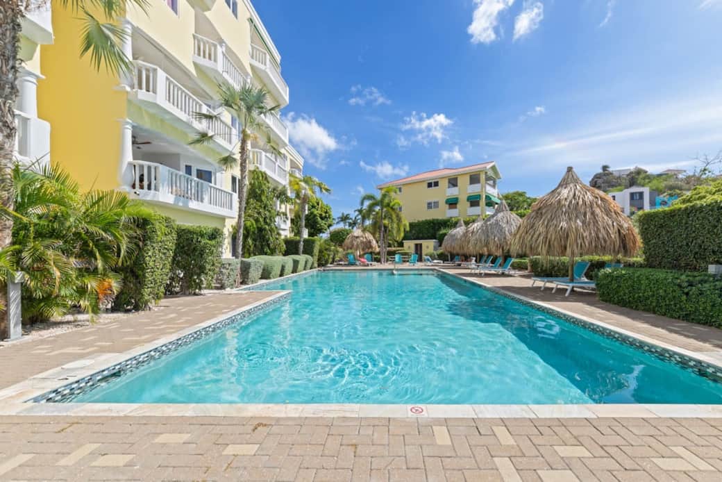 Large shared pool with plenty of sun loungers and seating areas Large shared pool with plenty of sun loungers and seating areas