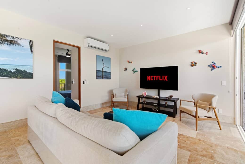 Not only does the living room offer direct access to your private balcony with A/C and room-darkening shades, but you can also enjoy streaming your favorites on the 65-inch TV. The comfy couch and cozy chairs are perfect for relaxing after the beach.