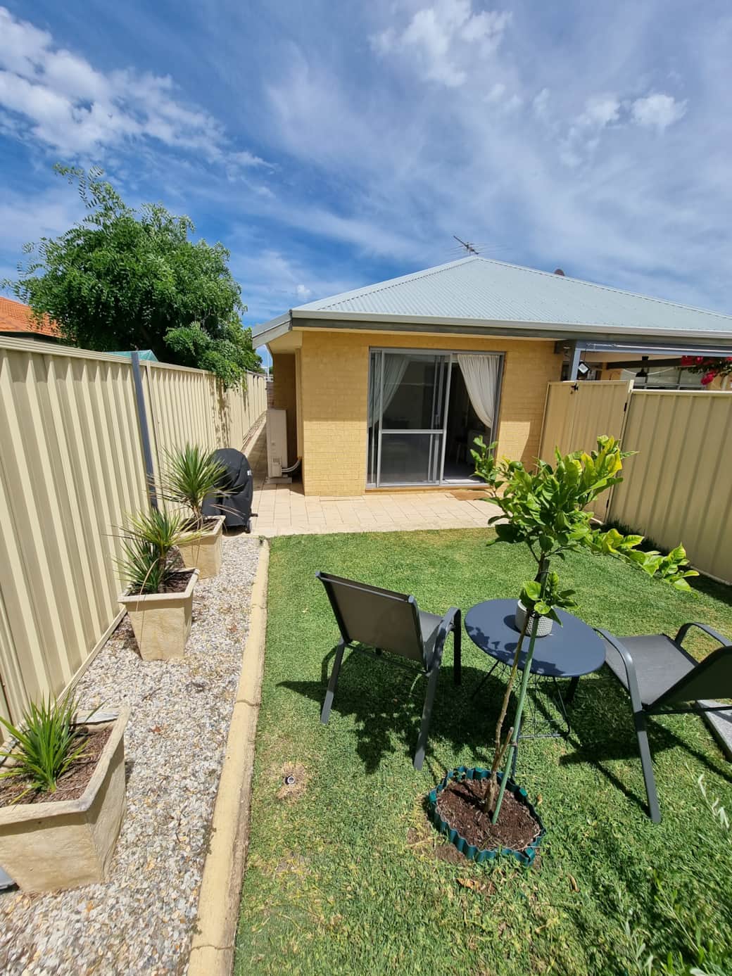 Secluded lawned garden with BBQ
