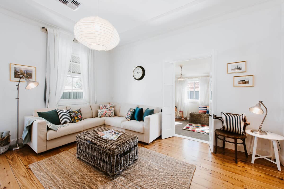 The living area boasts a large L-shaped sofa to sink into, side tables for your wine, and cozy nooks perfect for flipping through a magazine or book. The inviting space also leads to the children's bedroom, ensuring connection for the whole family.