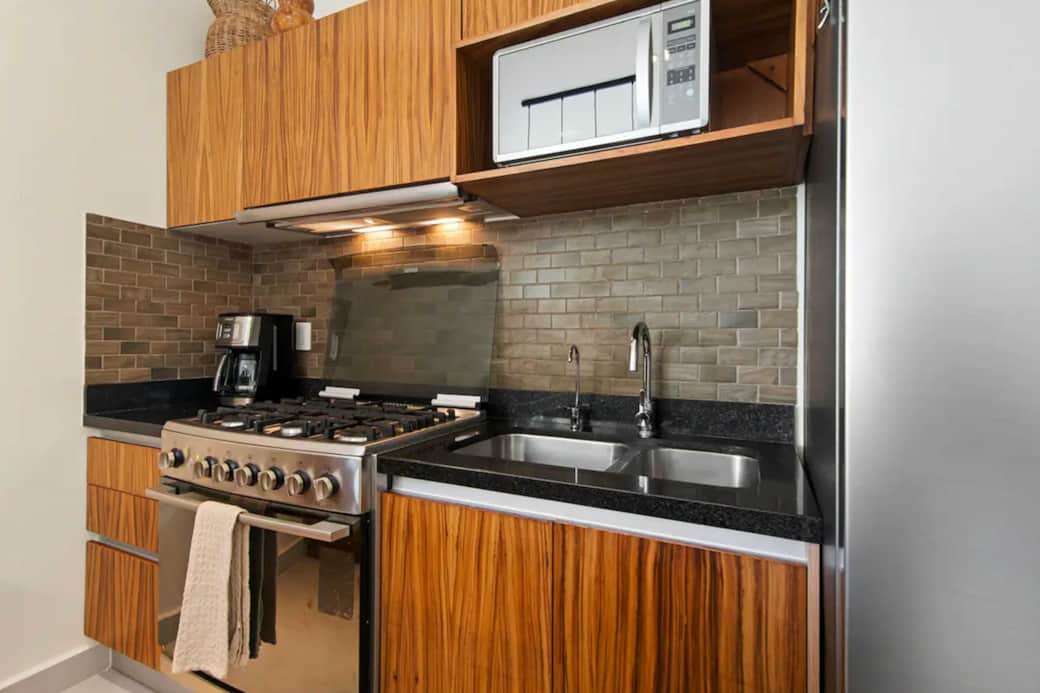Elevate cooking with our kitchen’s microwave, blender, toaster, and 6-burner stove.