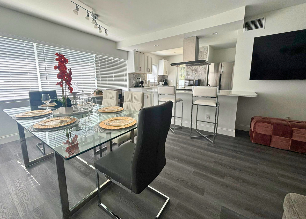 Modern dining area, well-lit with stylish decorative artwork. Lakeland, FL