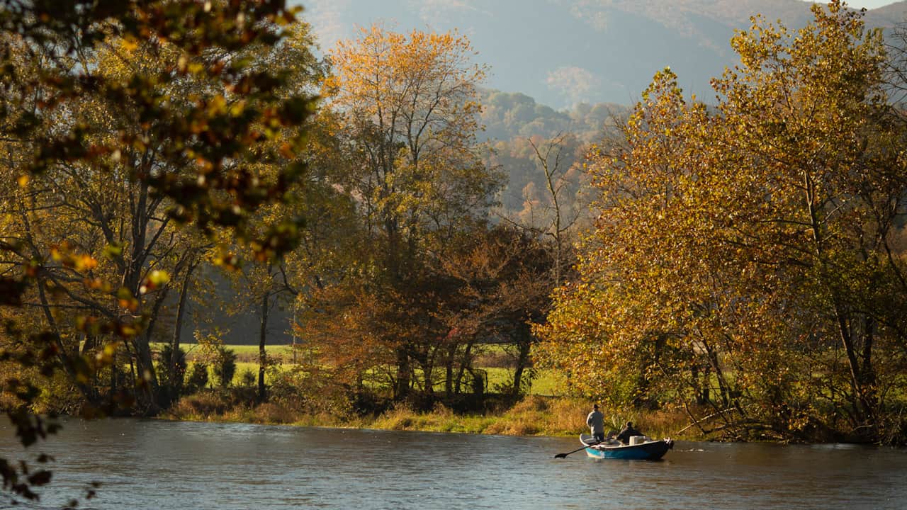 Guide Boats passing by Tailwaters Lodge on the South Holston River