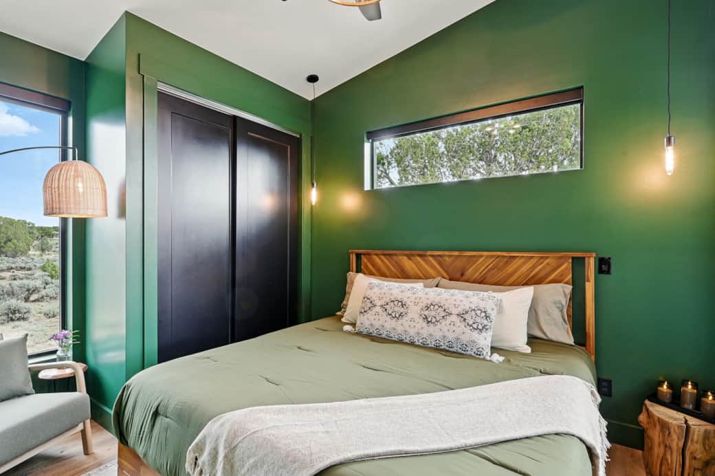 Luxurious king bed with cozy linens, perfect for restful nights.