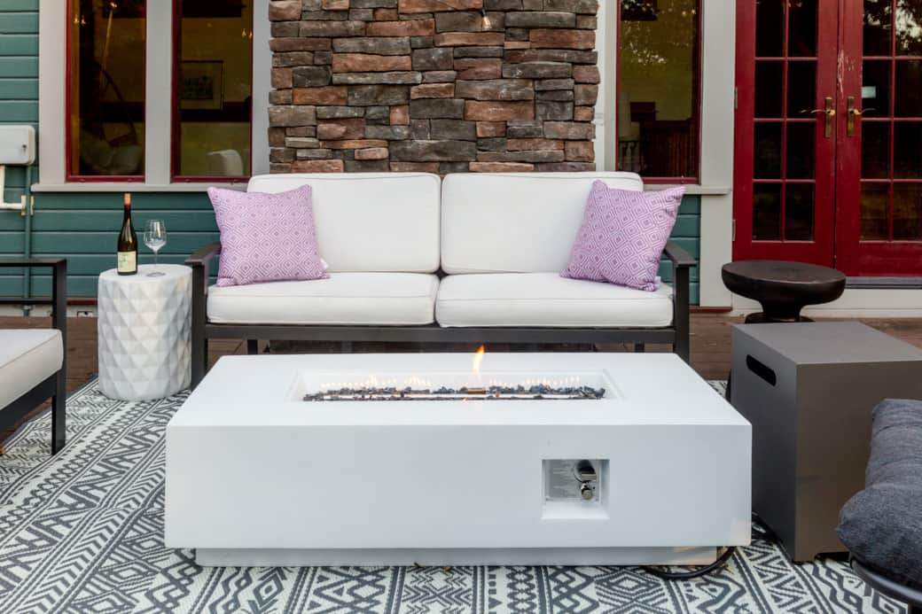 Back Porch with string lights, comfortable seating and fire pit