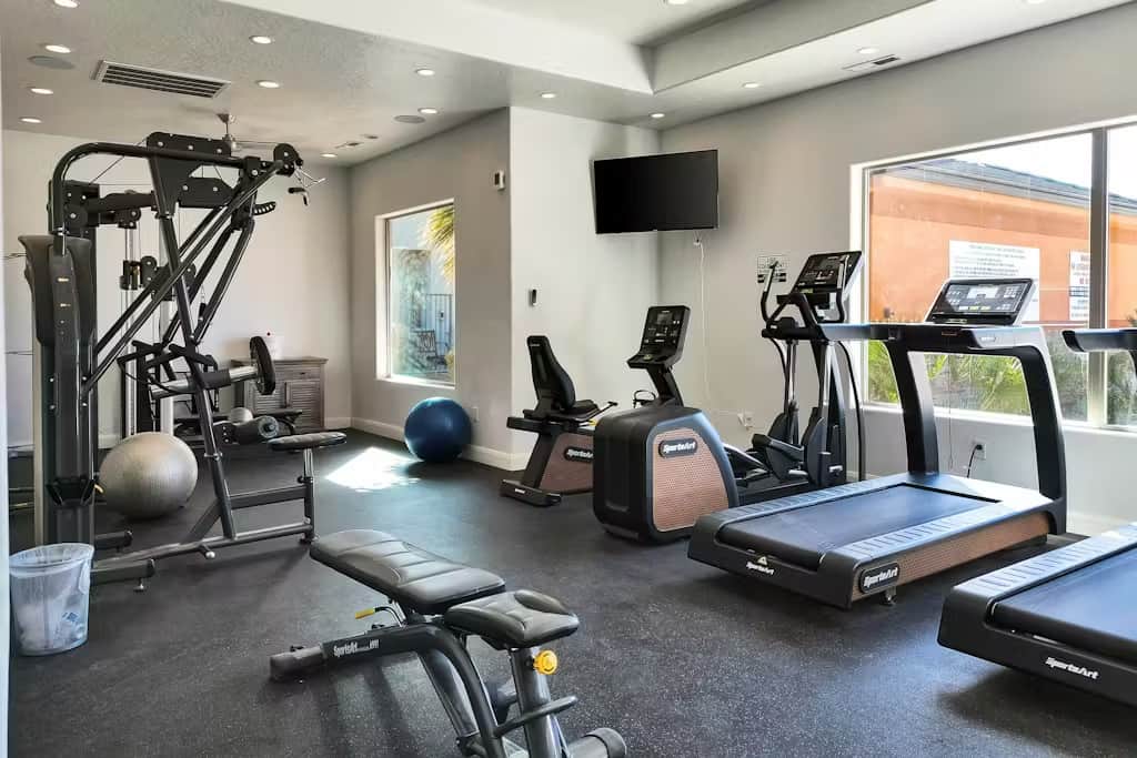 This modern fitness center is a great way to continue your workout plan and watch some TV. 