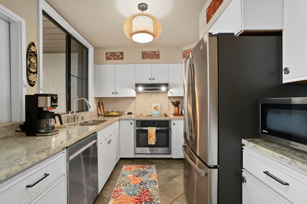 Bright, modern kitchen with stainless appliances—perfect for effortless island living.