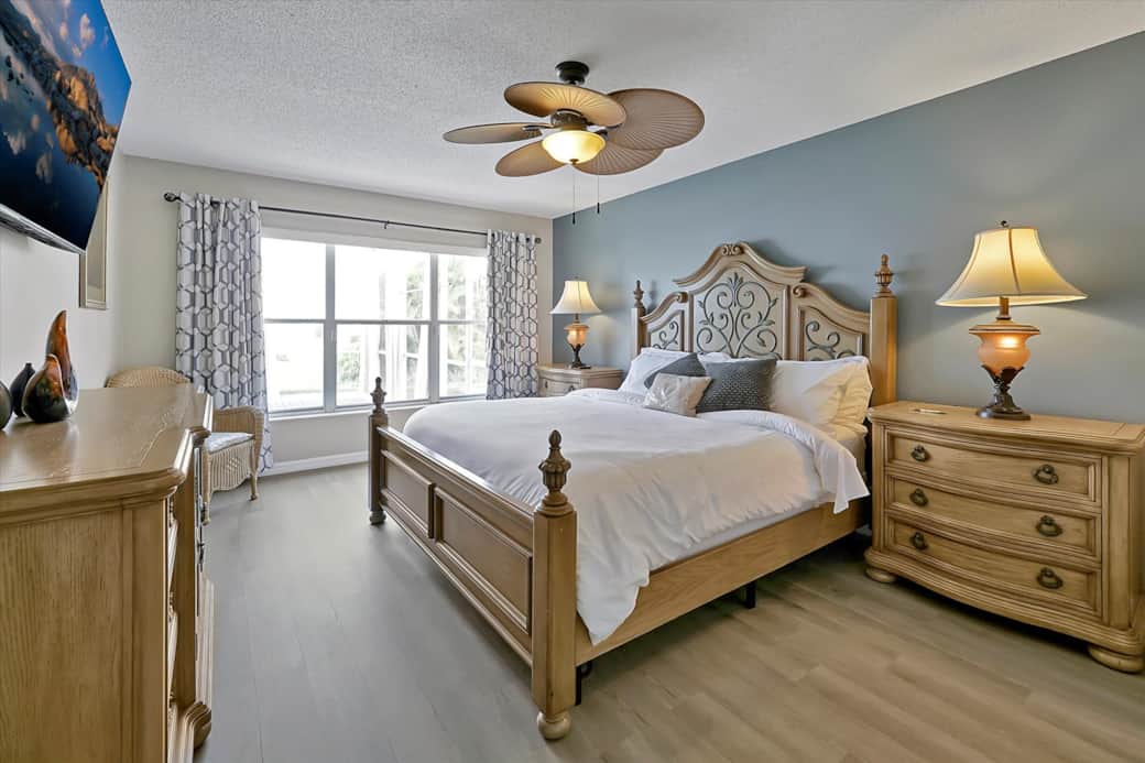 First floor Master Bedroom featuring a king-sized bed 