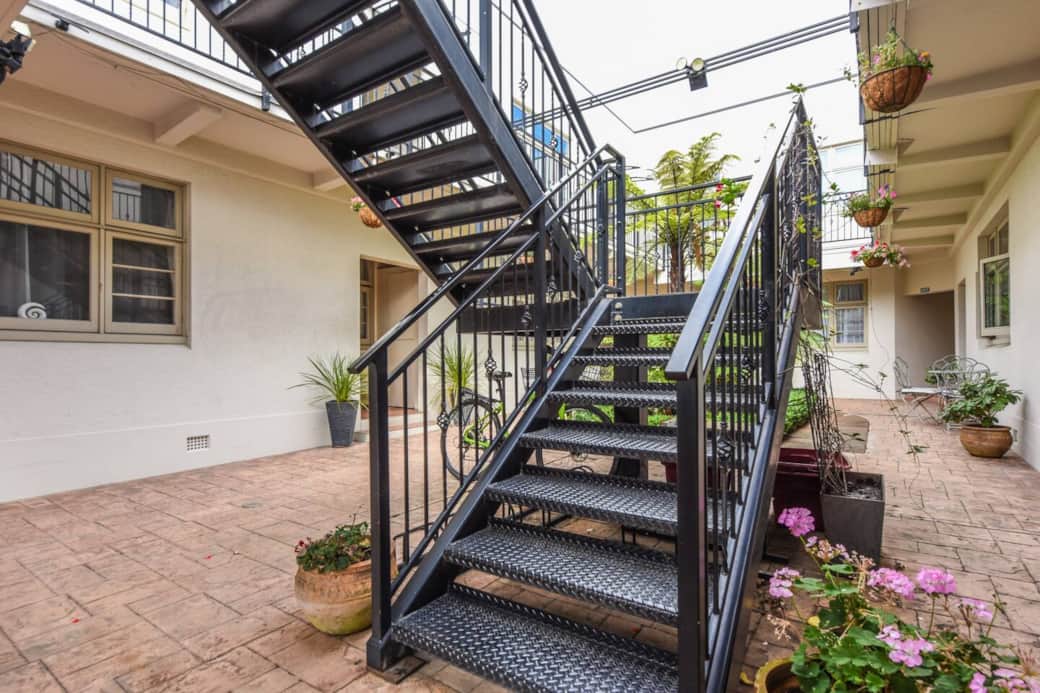 This charming Art Deco building features courtyard bicycle storage and a locked gate.