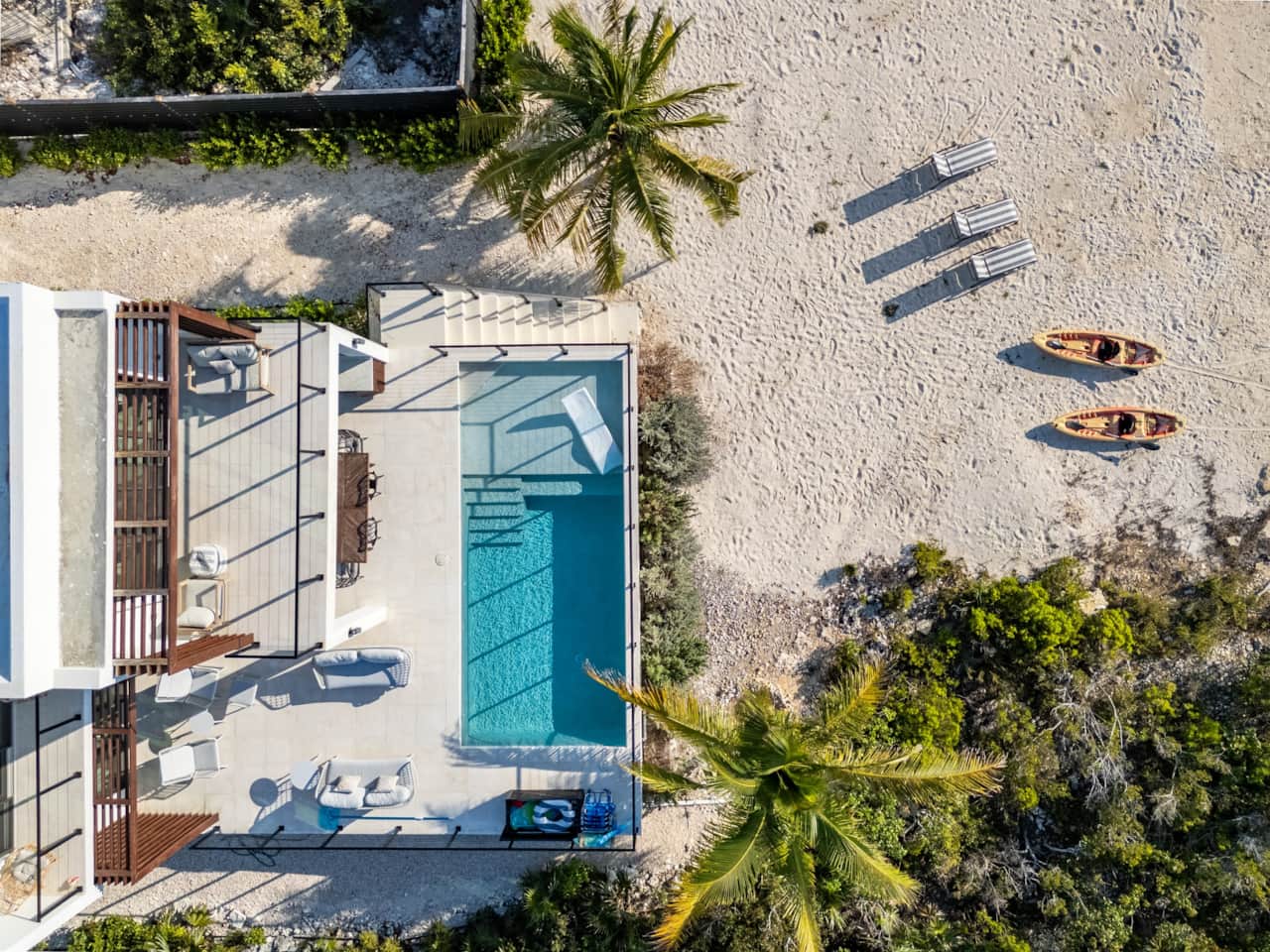 Pool, sun loungers and kayaks from above