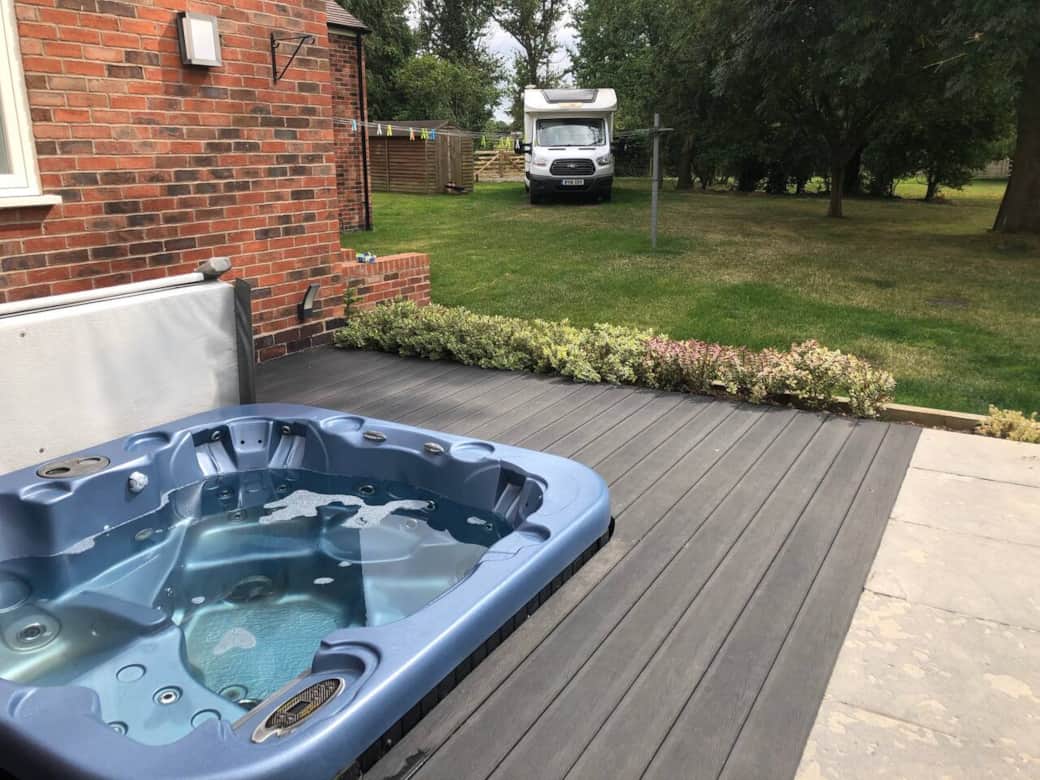 The hot tub is sited on the patio of the main house The hot tub is sited on the patio of the main house