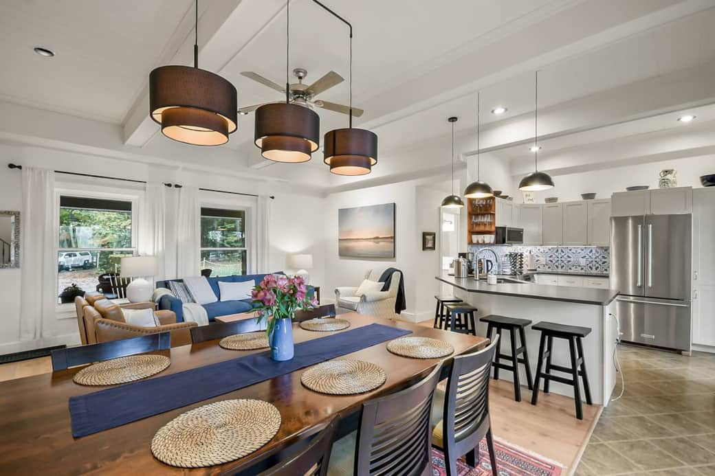 There is a generous amount of prep space that faces out into the living room and dining room. There are 4 bar stools that tuck under the counter.