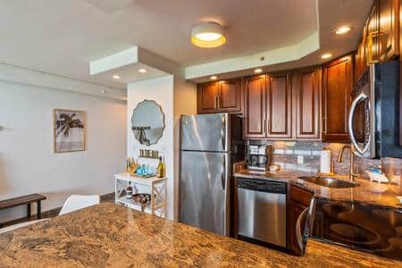 Under counter lights and dimmable pot lights throughout kitchen area. 