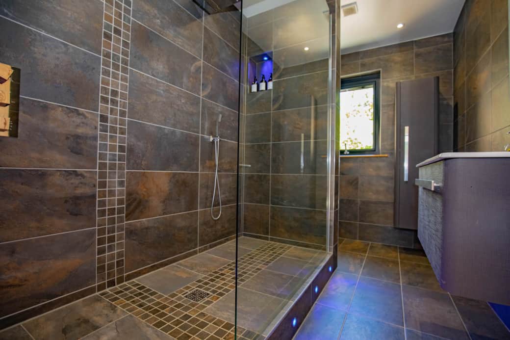 African slate style walk in wet room with cascade Shower