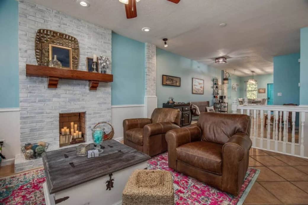 This "shotgun house" is just one space after another of rustic elegance that feels like home. 