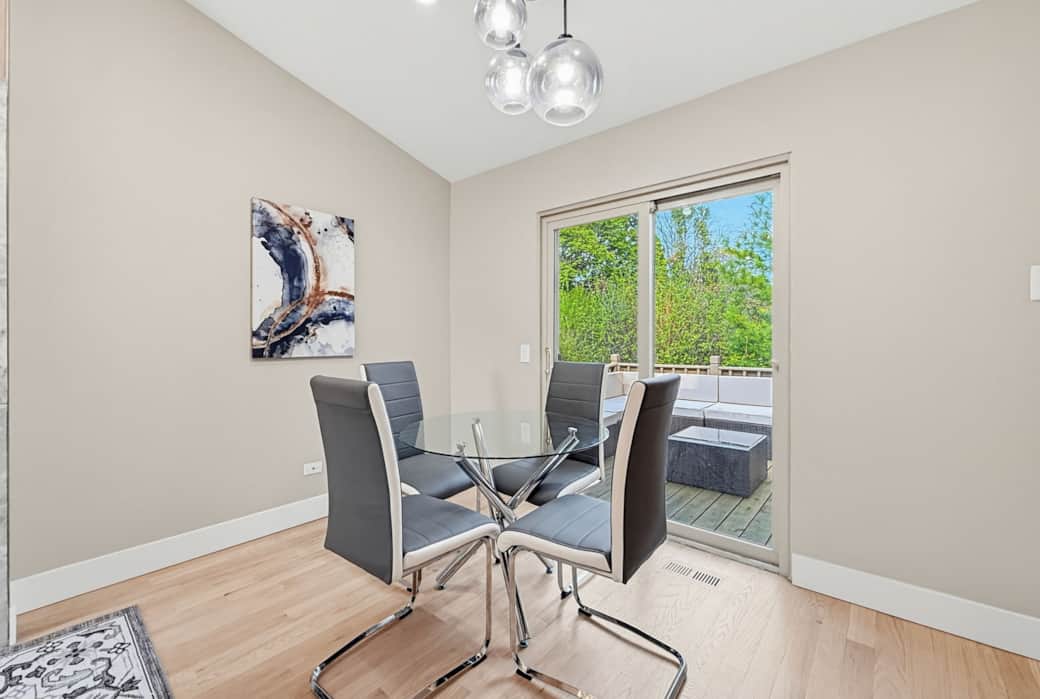Dining Area: Seats 4; adjacent to kitchen and living with sliding doors to the deck.