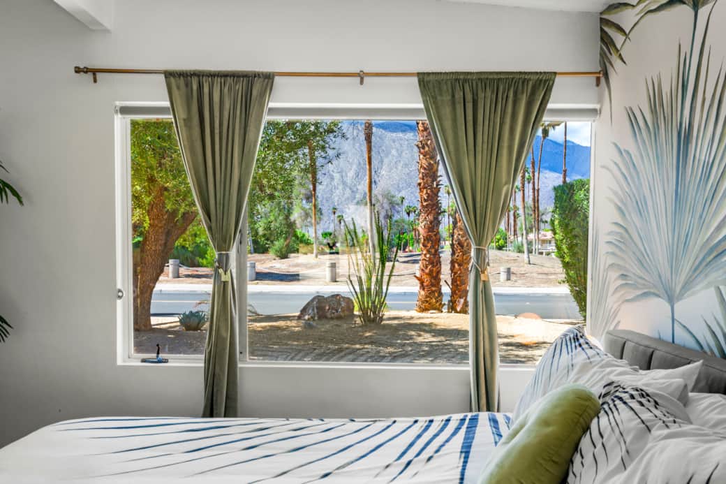 Palm-print calm, mountain views, mid-century charm.