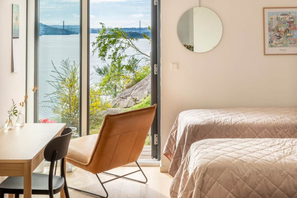 Beautiful views of the city fjord from the bedroom. A dedicated workspace with a desk. The bedroom f