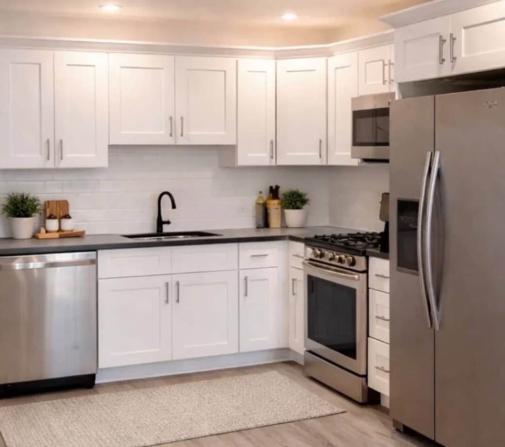 full  Kitchen with oven stove, double door refrigerator, and dishwasher.