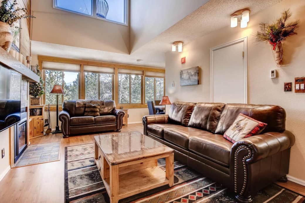 Living Room with wall to wall windows overlooking downtown Breckenridge. New leather queen sleeper sofa. Living Room with wall to wall windows overlooking downtown Breckenridge. New leather queen sleeper sofa.