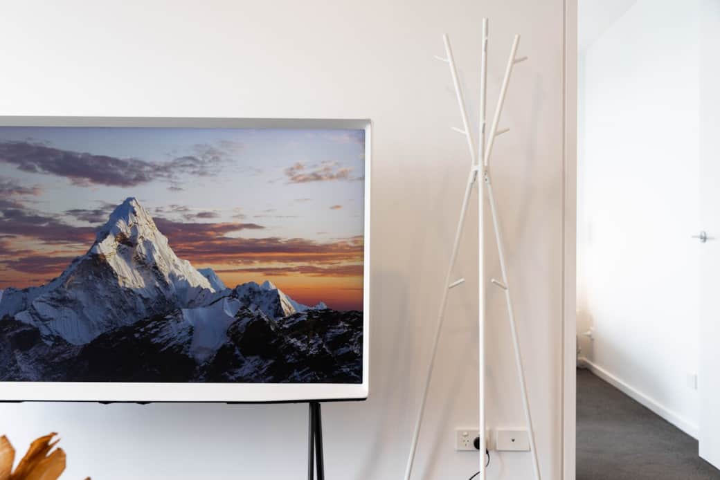 Enjoy the latest movies or your favorite shows on the sleek, flat-screen TV. The stand also serves as a stylish display for decorative items, adding a personal touch to the room. 