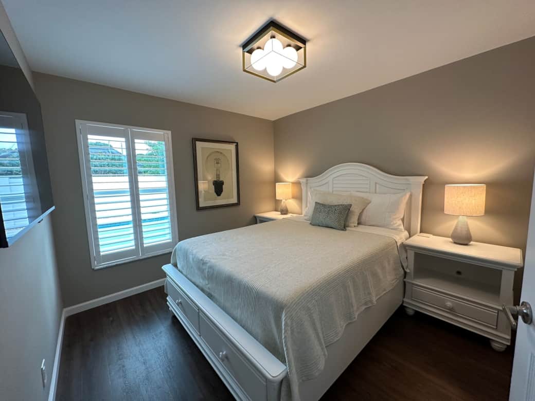 Bedroom #2 with new Serta iComfort Queen Bed, Dyson HEPA Filter Fan, 55" Roku Smart TV, Voice Remote with headphone port, Dimmable Lighting, USB Charging port, Closet, Luggage Rack, Smoke/CO2 Detector.