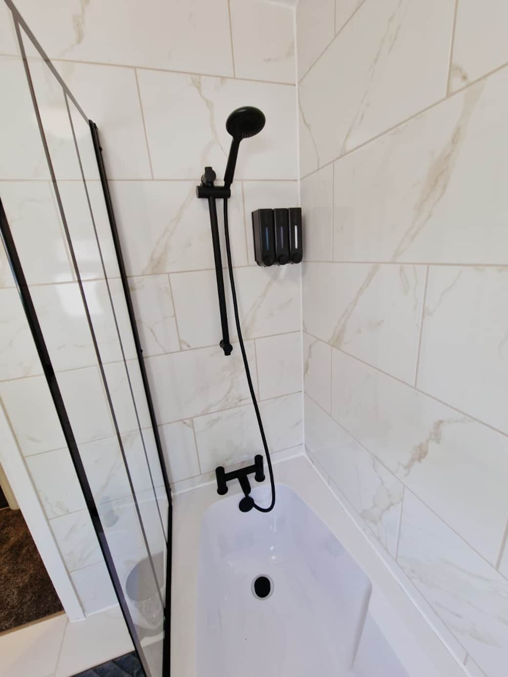 Contemporary bathroom with shower bath.
