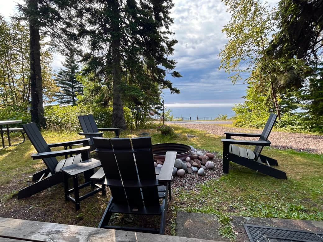 Enjoy your private firepit with gorgeous Lake views. Picnic table to left. Beach access.