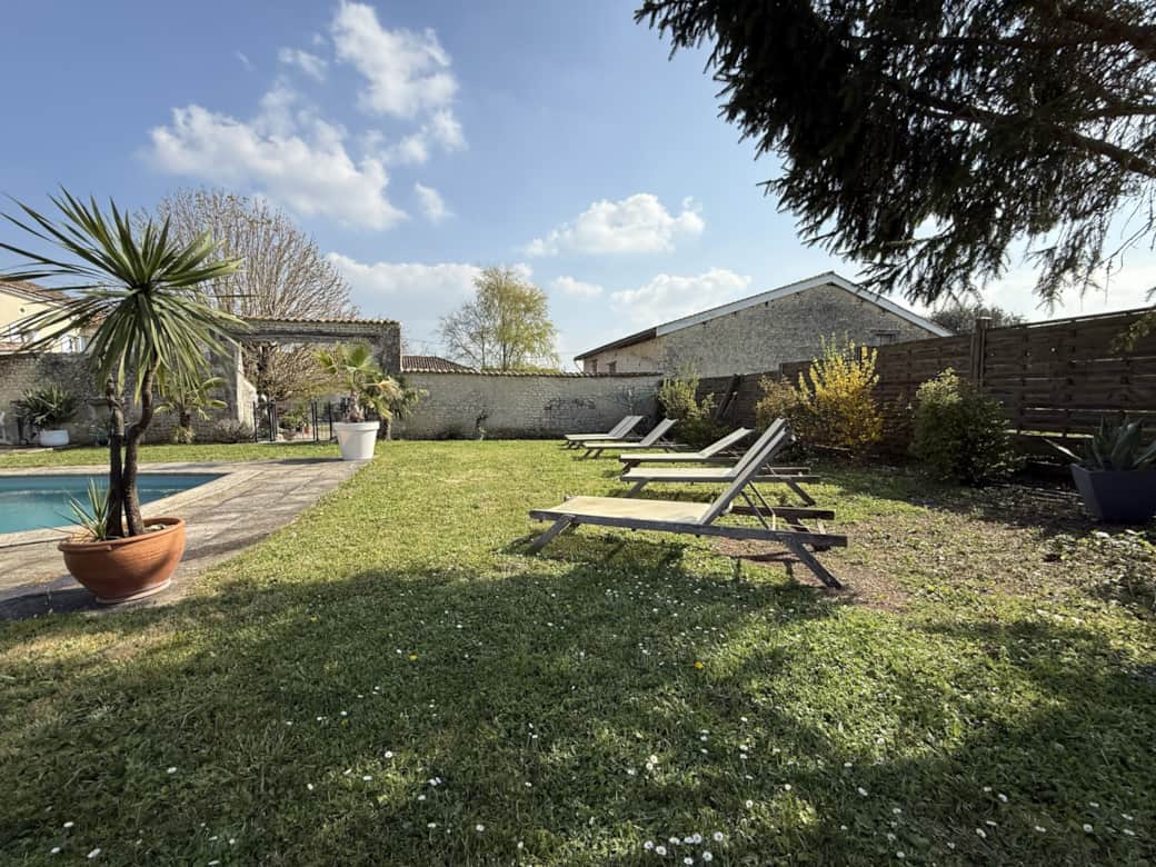 Private swimming pool with secure access and a pool house