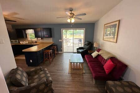 Family room with lake view and another futon Family room with lake view and another futon