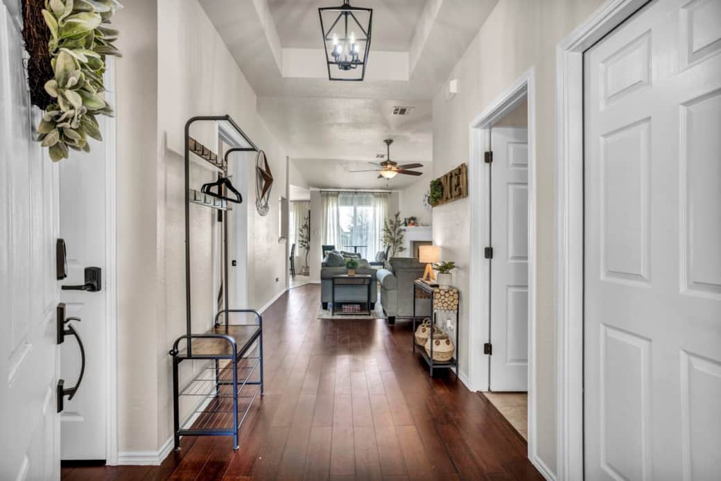 Once you enter the home, you are welcomed with a natural light and a spacious open view of the living room and rear window. Once you enter the home, you are welcomed with a natural light and a spacious open view of the living room and rear window.