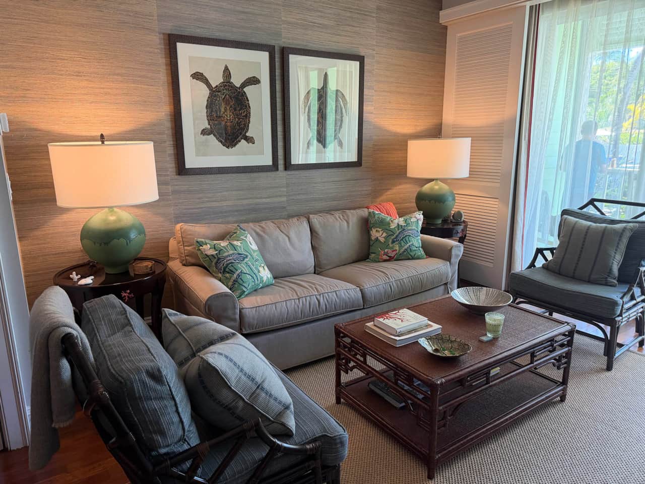 Gather with loved ones in this cozy Harbour Island living space offering easy sunny balcony access
