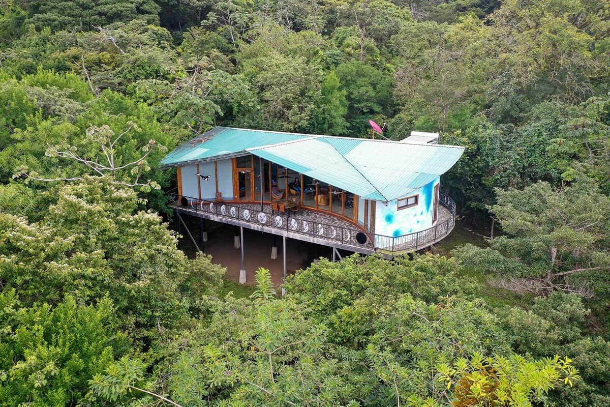 The house blends beautifully with nature, offering privacy and scenic surroundings.