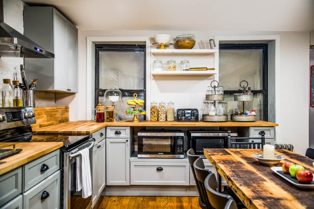 Check out this spacious kitchen with plenty of counter space and a beautiful wooden table