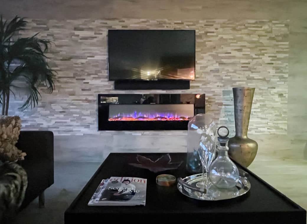 Cosy Nights In: Unwind in style with the warm glow of the modern electric fireplace, perfect for movie marathons or a relaxing evening in this chic, comfortable living space.